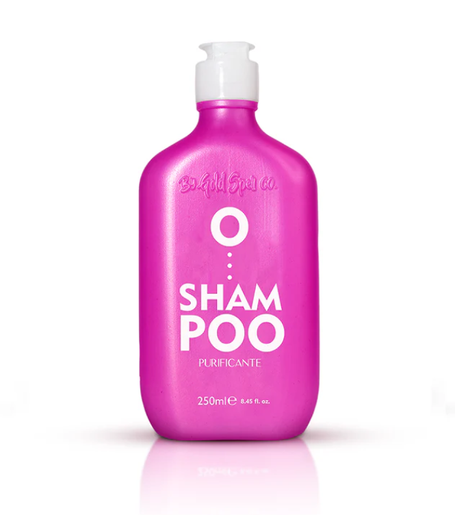 Frasco rosa de champô purificante com tampa branca