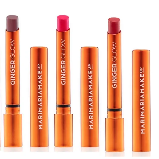 Três batons com embalagem laranja e texto branco, diferentes tons de batom visíveis.