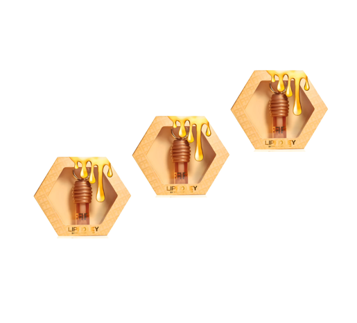 Três embalagens hexagonais de lip balm com design de mel e aplicador favo