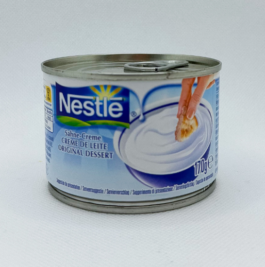Lata metálica de creme de leite Nestlé 170g com rótulo azul e branco