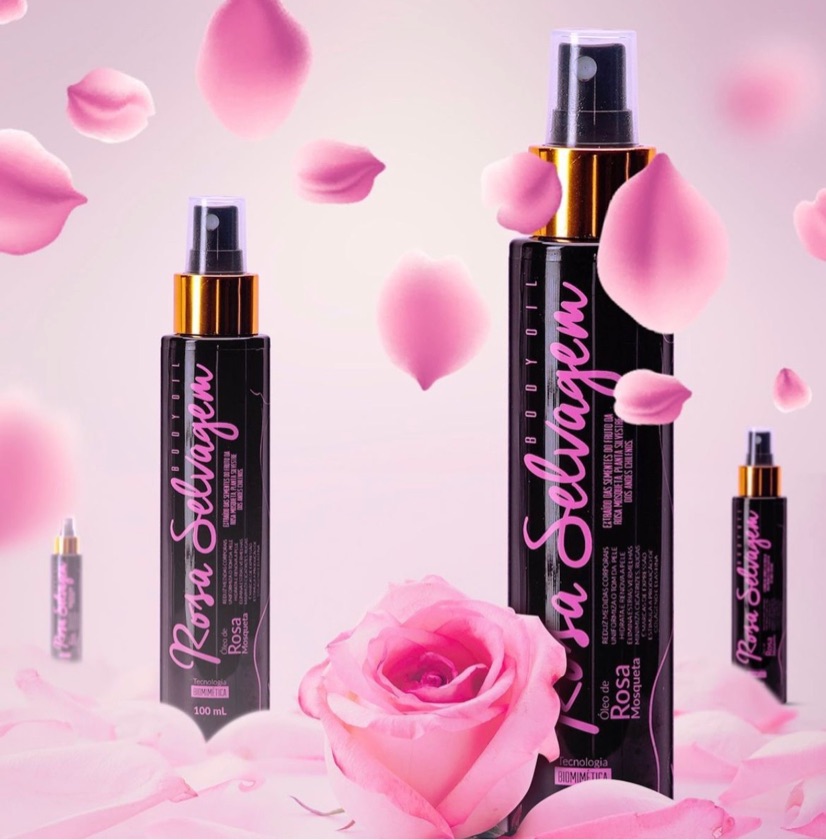 Frascos de spray pretos com texto rosa e tampa dourada com pétalas e uma rosa cor de rosa
