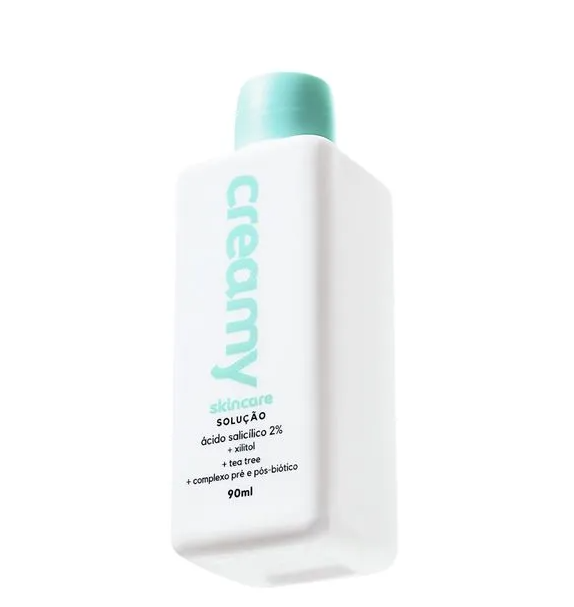 Frasco branco com tampa azul-claro de solução de cuidado da pele