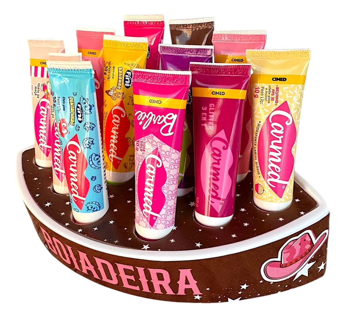 Conjunto de tubos de creme labial Carmed em expositor castanho decorado com estrelas e texto BOLADERA