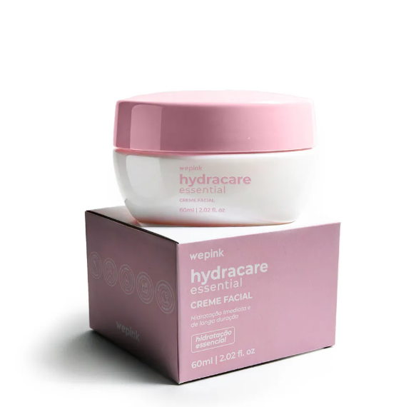 Creme facial em frasco branco com tampa rosa e caixa rosa 'wepink hydracare essential'