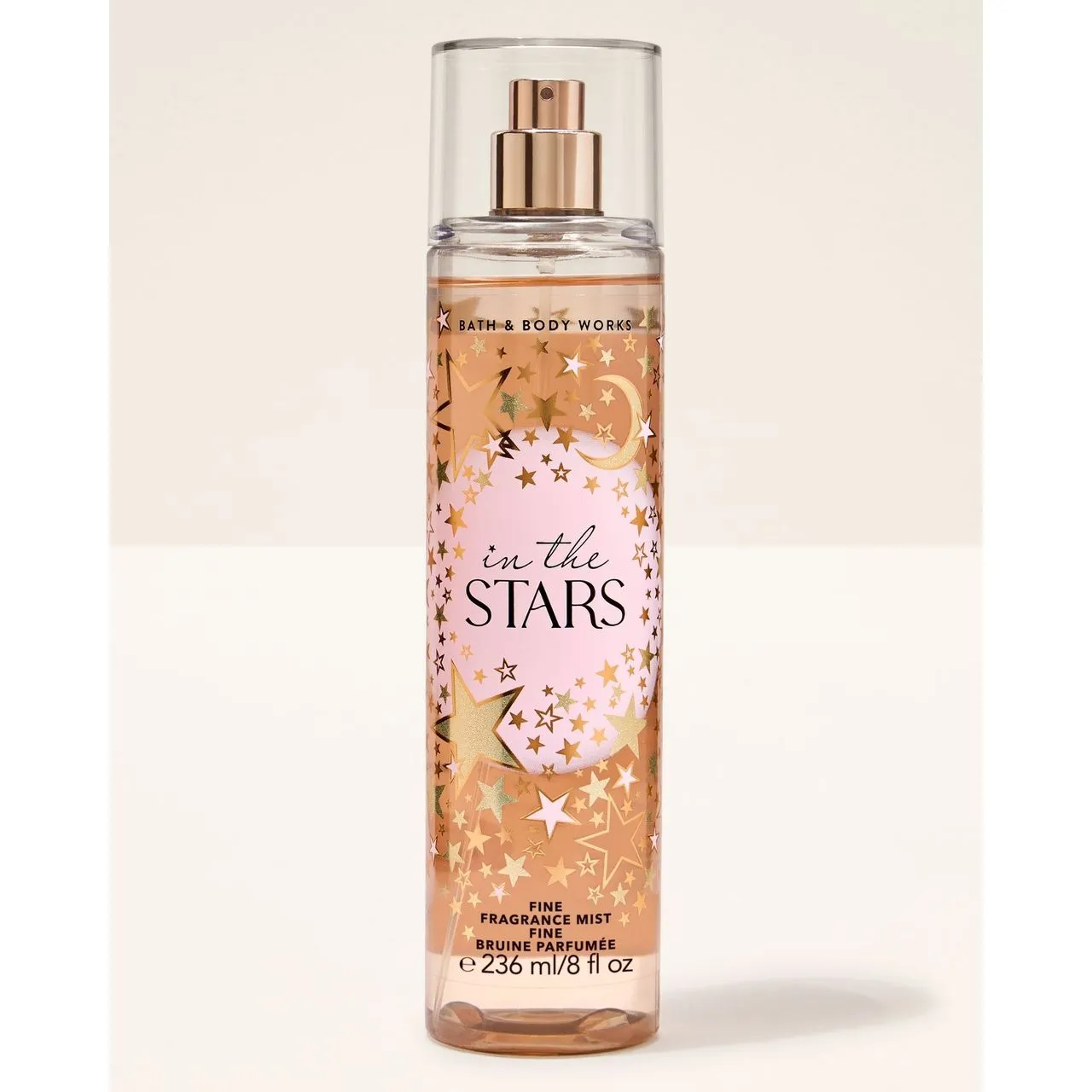 Frasco de perfume in the stars com decoração de estrelas douradas