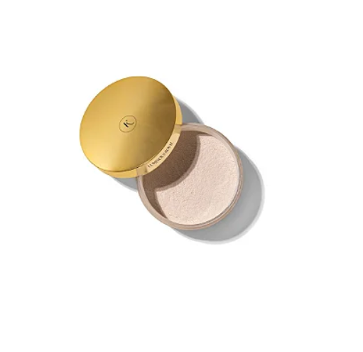 Pó facial solto em embalagem redonda bege com tampa dourada