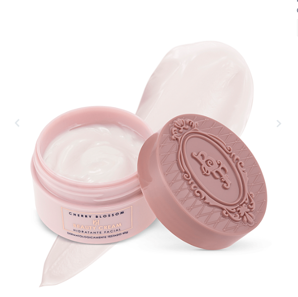 Creme facial hidratante Cherry Blossom em embalagem redonda rosa com tampa decorada