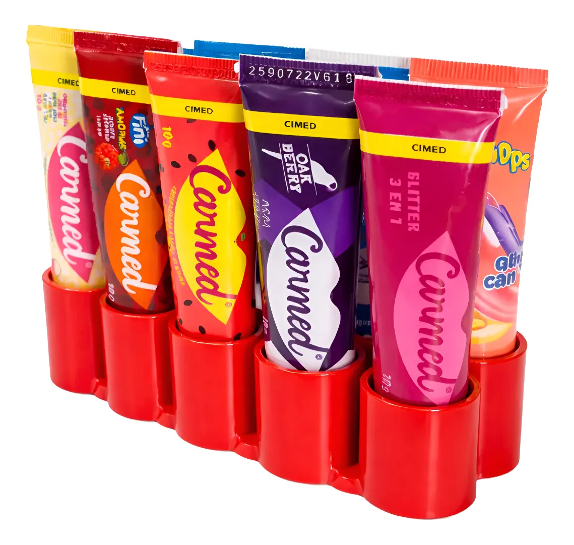 Seis tubos coloridos de pasta Canned com selo CIMED organizados num suporte vermelho