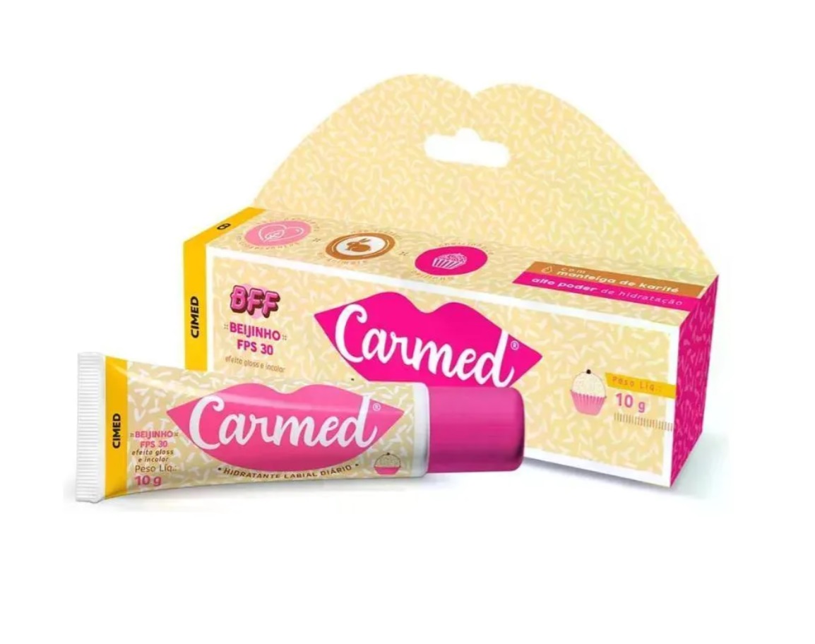 Creme lábios Carmed FPS 30 em tubo rosa com embalagem amarela e rosa.