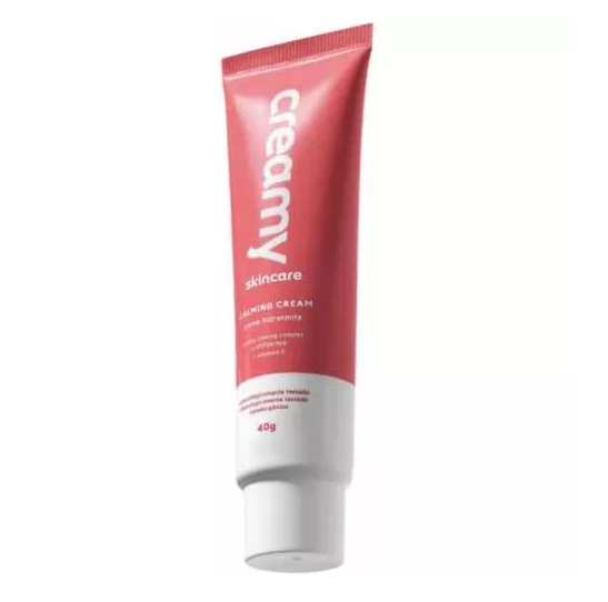 tubo de creme para cuidados da pele creamy rosa e branco com texto e tampa branca