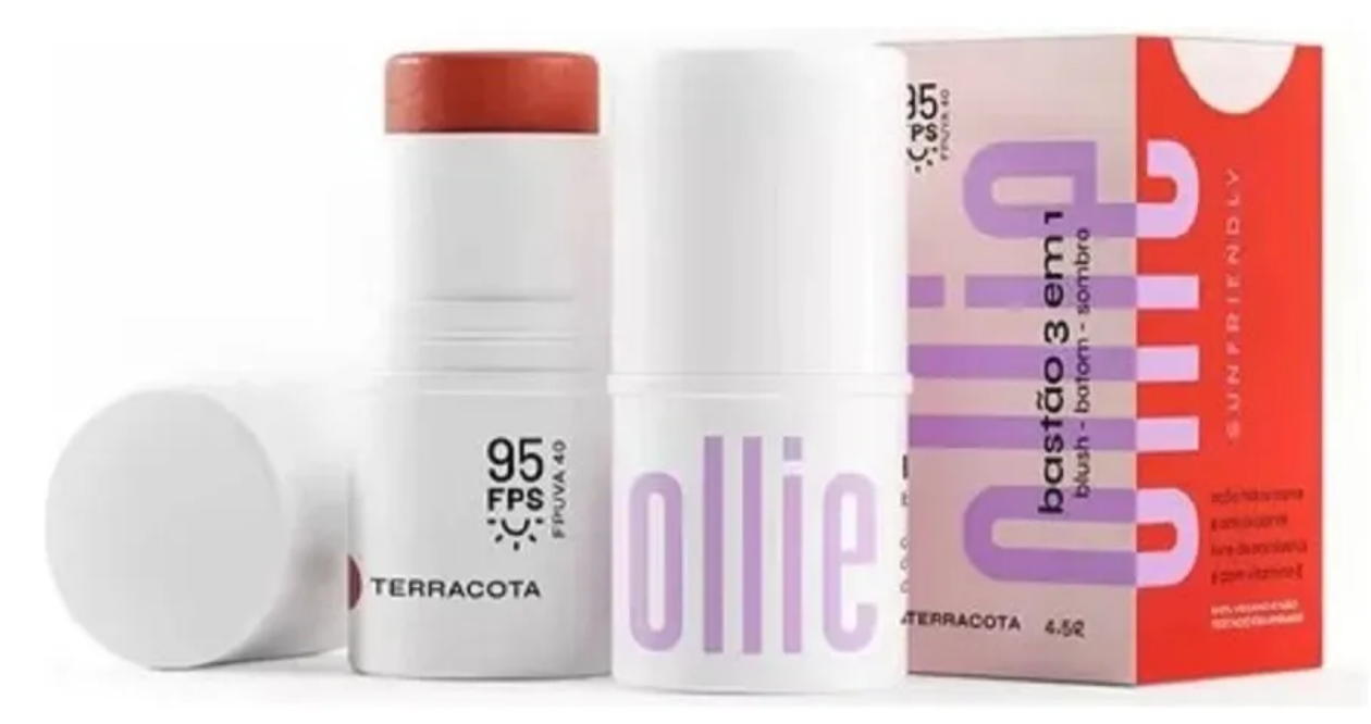 Produto cosmético Terracota em embalagem branca com tampa vermelha e embalagem de papel colorida