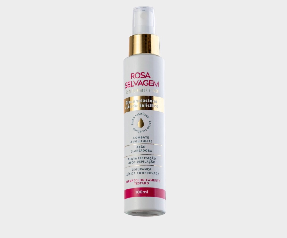 Frasco branco de spray com rótulo rosa e dourado