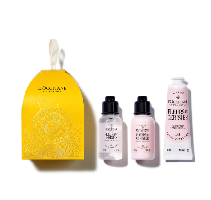 Conjunto LOccitane en Provence Fleurs de Cerisier com embalagem amarela e produtos em frascos pequenos.