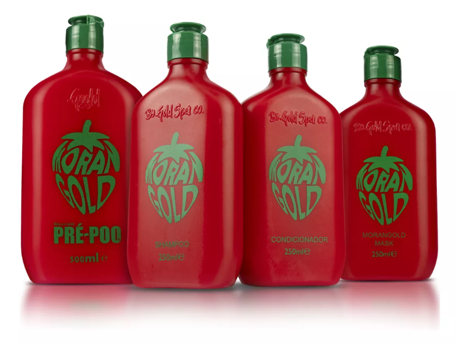Conjunto de 4 frascos vermelhos com tampa verde de produtos MORAN GOLD para cabelo