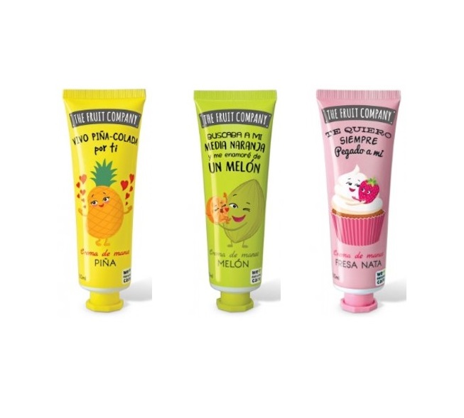 Três tubos coloridos de creme de mãos com desenhos de frutas e texto em espanhol