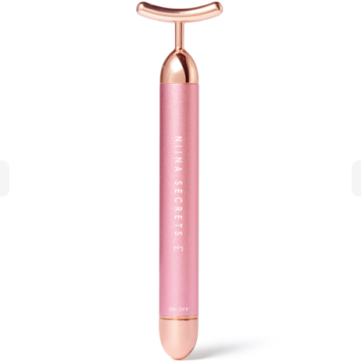 Massajador facial rosa e dourado com texto NINA SECRETS