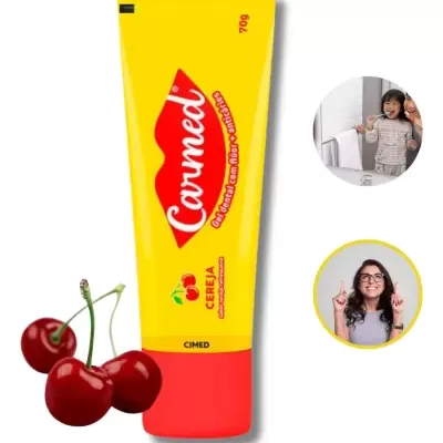 Gel dental Carmed sabor cereja em embalagem amarela e vermelha com cerejas ao lado