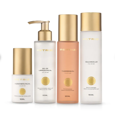 Conjunto de produtos faciais PETRIZI em embalagens douradas e transparentes