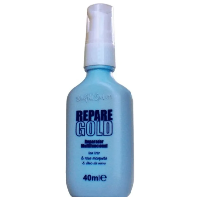 Frasco azul com bomba doseadora branca de produto cosmético REPARÉ GOLD