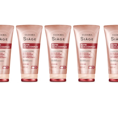 Cinco embalagens rosa claro de condicionador Eudora Siàge Nutri Acid.Complex alinhadas