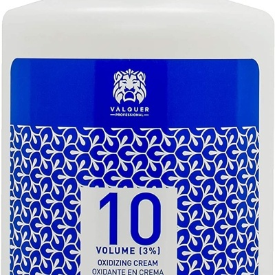 Frasco branco de creme oxidante com rótulo azul e branco e texto informativo.