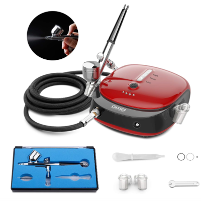 Kit de aerógrafo com compressor vermelho e preto e acessórios organizados