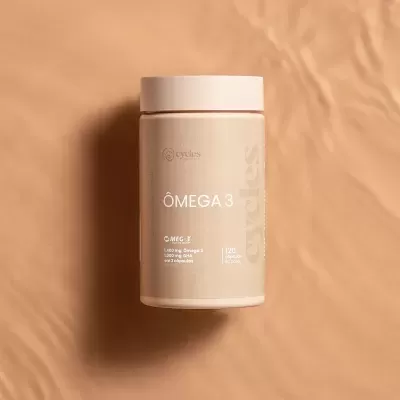 Frasco creme de suplemento alimentar ÔMEGA 3 da marca Cycles em fundo castanho