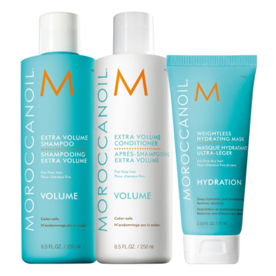 Produtos Moroccanoil shampoo, condicionador e máscara hidratante em frascos e tubo azul e branco