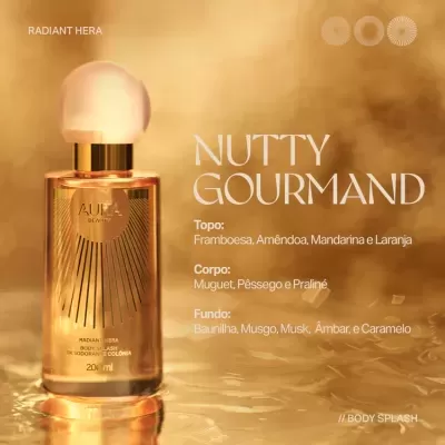 Frasco de Body Splash dourado Aura Beauty com tampa branca e texto descritivo dos aromas