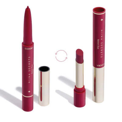 Dois batons Eudora Nina Secrets vermelhos escuros com detalhes dourados.