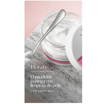 Frasco aberto de creme Floraty com colher prateada sobre superfície de pedra cinza