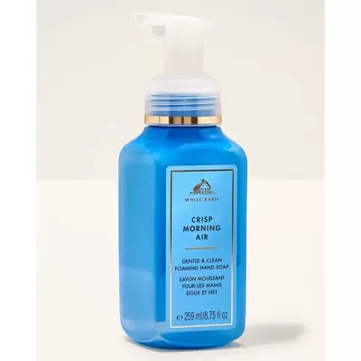 Frasco azul de sabão líquido para mãos com dispensador branco e etiqueta azul