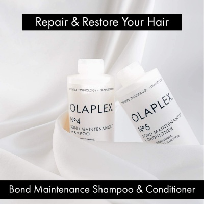 Dois frascos brancos de OLAPLEX Nº4 Shampoo e Nº5 Conditioner em tecido branco.