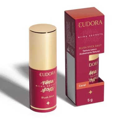 Blush Stick Eudora Niina Secrets cor Coral com embalagem vermelha e tampa dourada