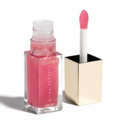 Frasco transparente de óleo labial rosa com brilho e texto EUDORA NIINA SECRETS LIP OIL
