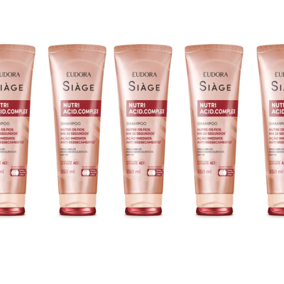 Cinco frascos de shampoo Eudora Siàge Nutri Acid Complex em fundo branco