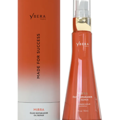 Frasco e caixa cilíndrica de óleo reparador Ybera Paris em tons laranja e branco.