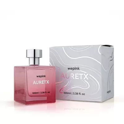 Frasco de perfume rosa e caixa cinzenta com texto wepink AURETX