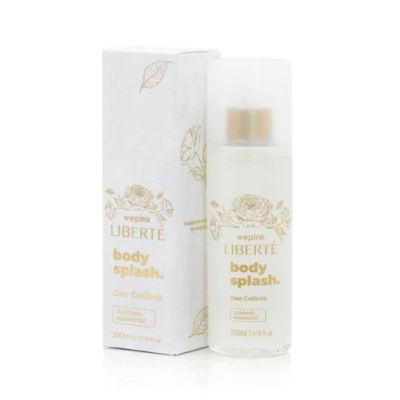 Frasco e caixa de body splash wepink LIBERTÉ com design branco e dourado