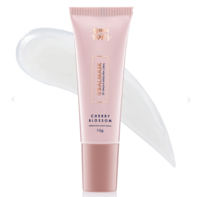 Tubo rosa claro de cosmético Cherry Blossom com tampa rosa escuro e textura branca atrás