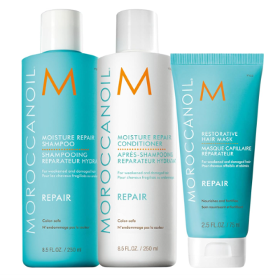 Três produtos Moroccanoil Repair: shampoo azul, condicionador branco e máscara capilar azul
