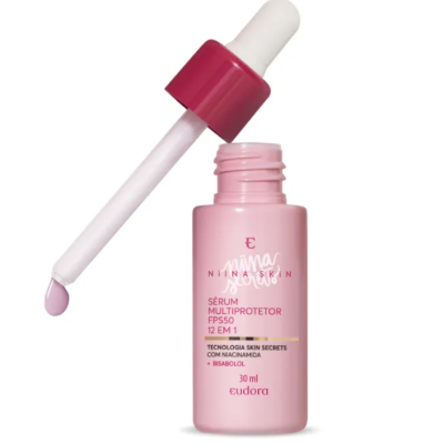 Frasco rosa de sérum com pipeta branca e rosa contendo líquido cor de rosa claro.