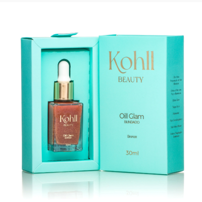 Frasco de óleo bronzeador Kohll Beauty Oil Glam Blindado na sua caixa azul-clara.