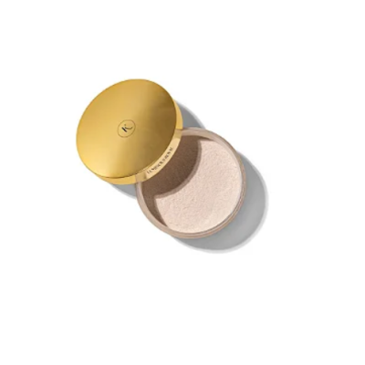 Pó facial solto em embalagem redonda bege com tampa dourada
