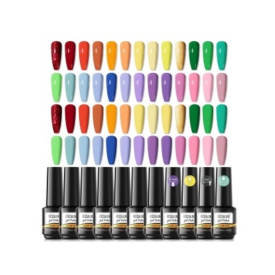 Conjunto de vernizes coloridos com amostras de unhas artificiais em várias cores