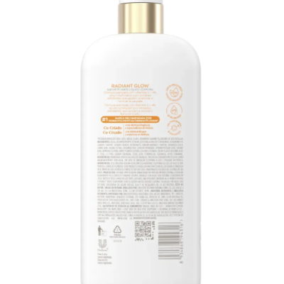 Frasco branco com bomba de doseamento dourada e rótulo com texto do produto Radiant Glow