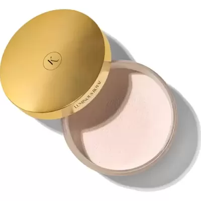 Pó solto em embalagem redonda com tampa dourada