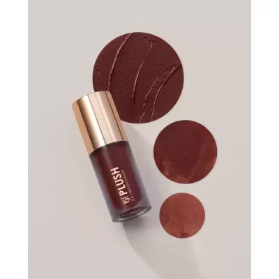 Frasco de batom e blush com tampa dourada e amostras de cor castanha