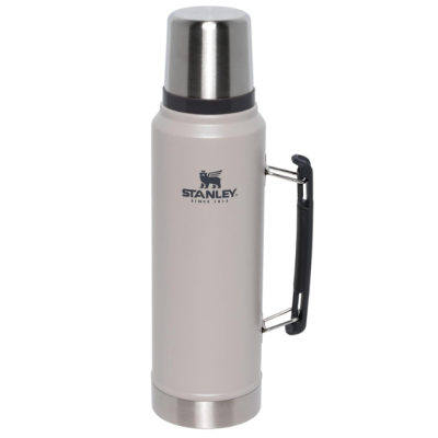 Garrafa térmica bege com tampa metálica e pega preta