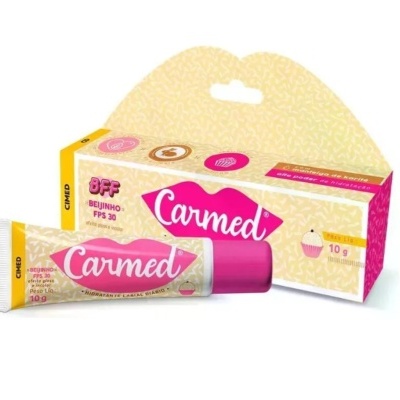 Creme lábios Carmed FPS 30 em tubo rosa com embalagem amarela e rosa.